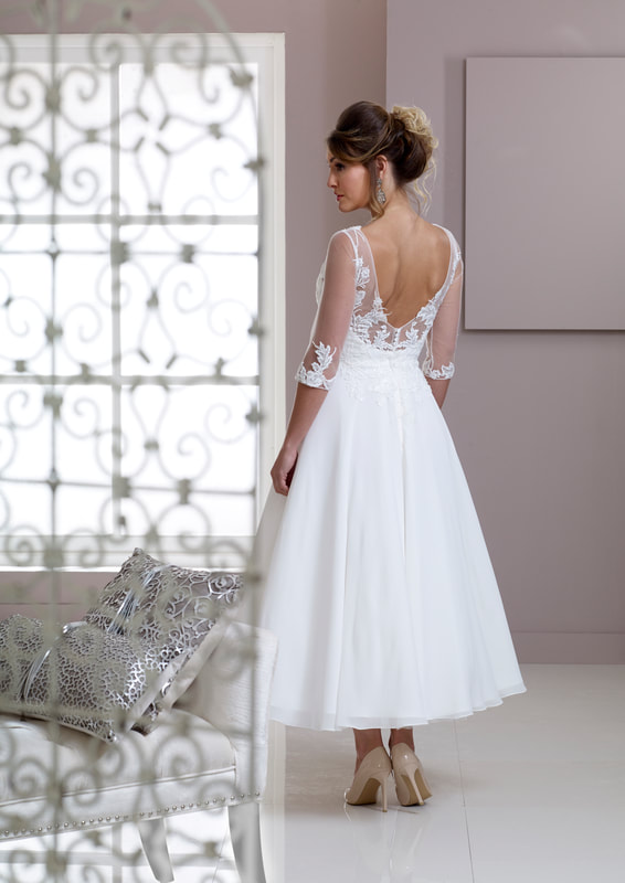 Illusion neckline wedding dress skin tone sleeves and lace.
