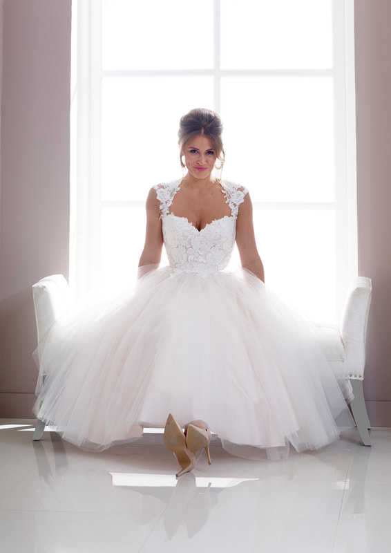 Sweetheart neckline tulle skirt tea length wedding dress.